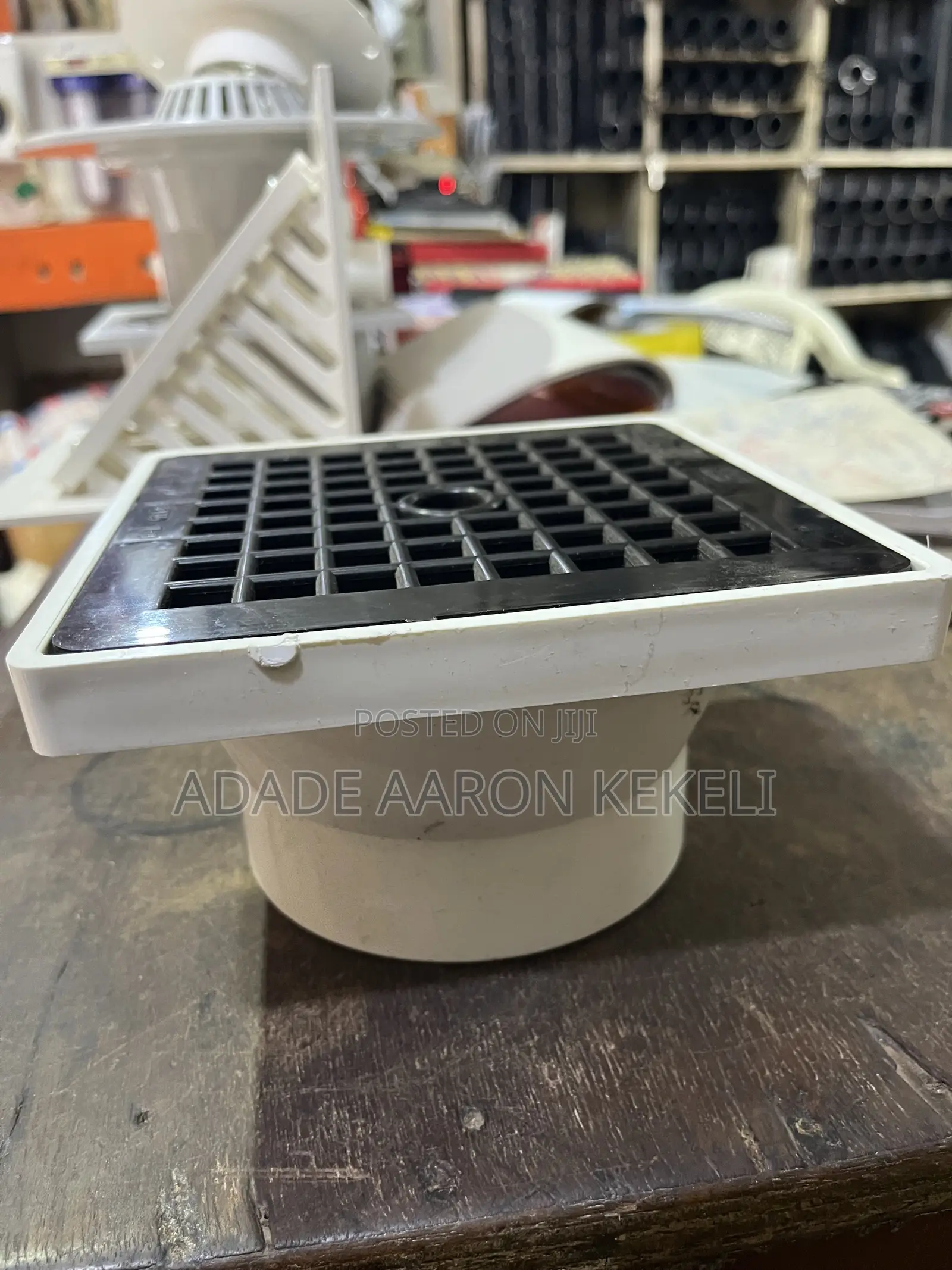 Heavy-Duty PVC Floor Drain With Black Grid Strainer Cover