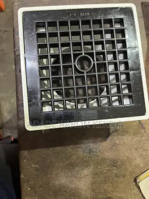 Heavy-Duty PVC Floor Drain With Black Grid Strainer Cover