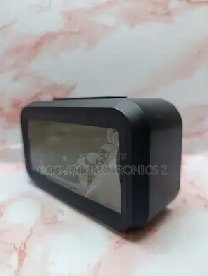 Optically Controlled Digital Alarm Clock With Temperature Display