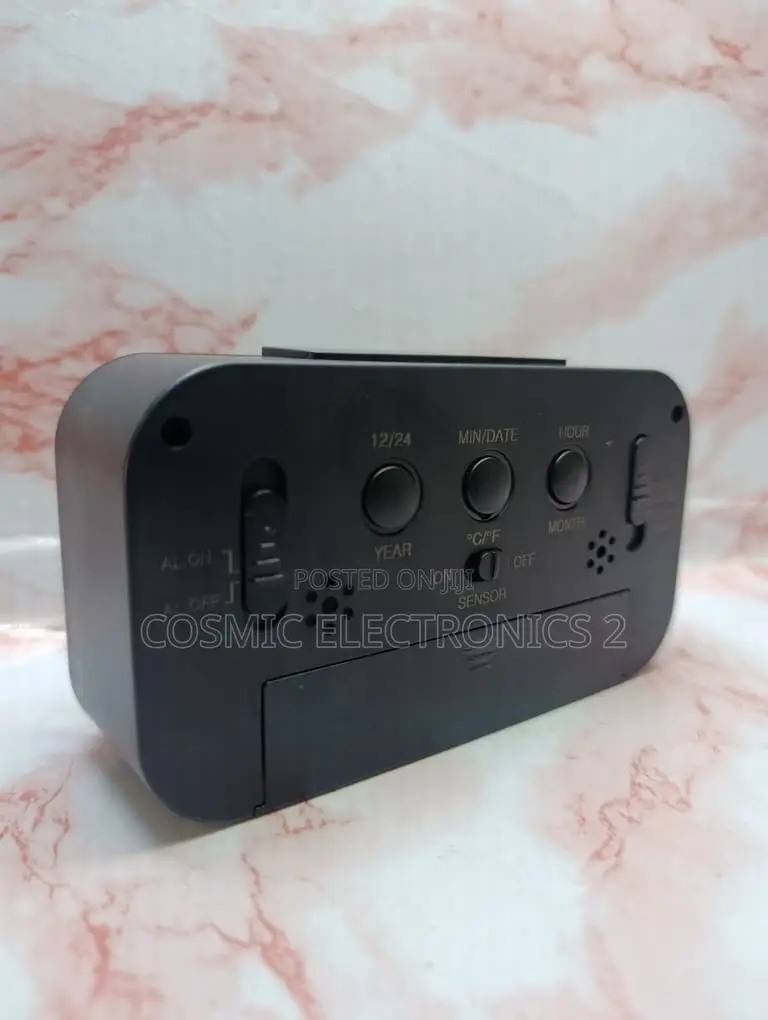 Optically Controlled Digital Alarm Clock With Temperature Display