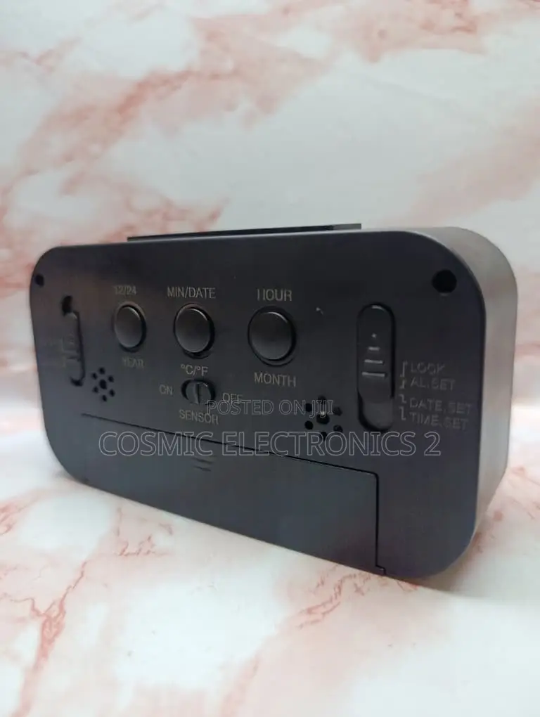 Optically Controlled Digital Alarm Clock With Temperature Display
