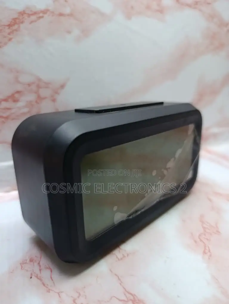 Optically Controlled Digital Alarm Clock With Temperature Display