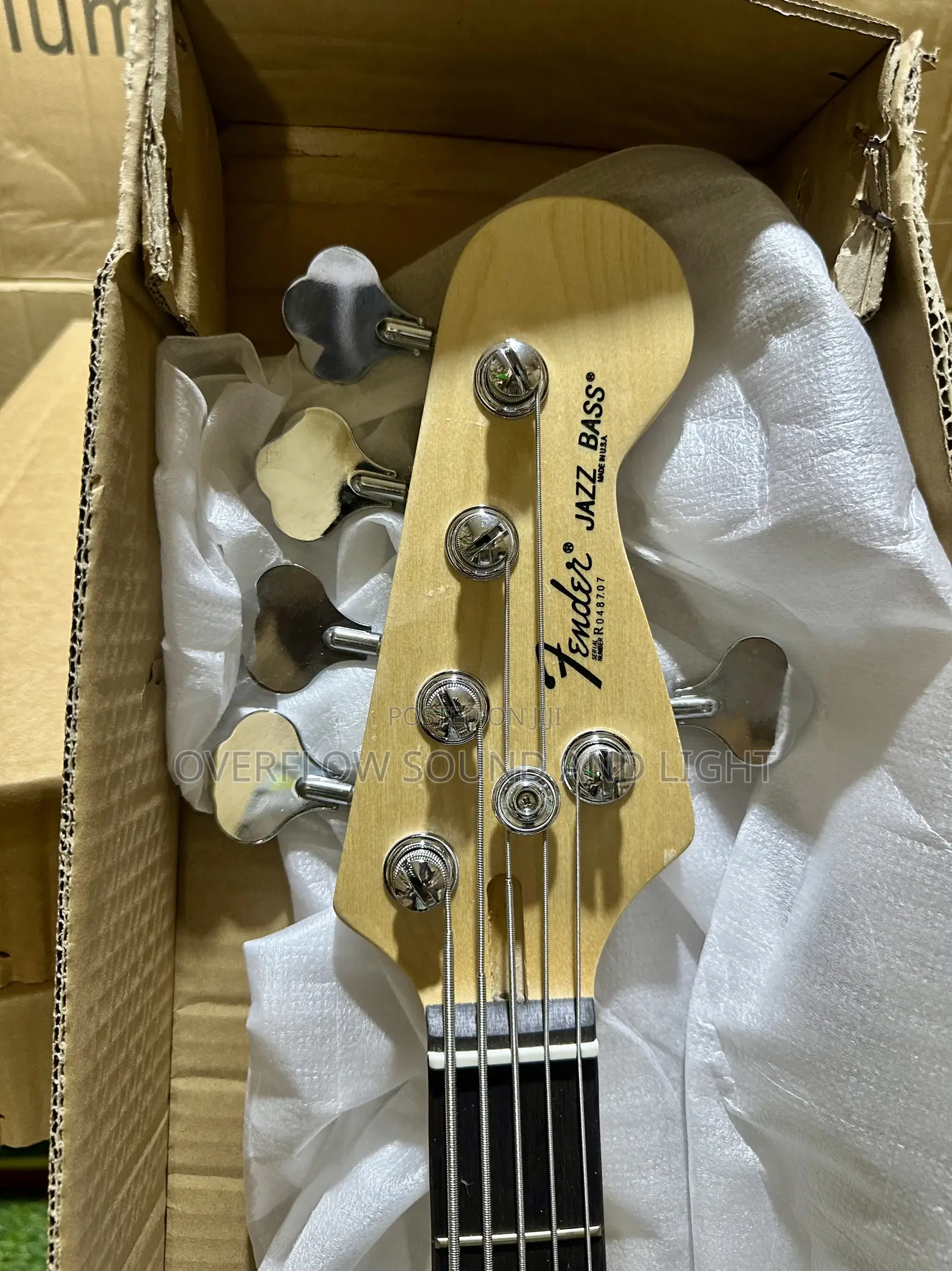 Fender 5-String Electric Bass Guitar With a Natural Wood Finish