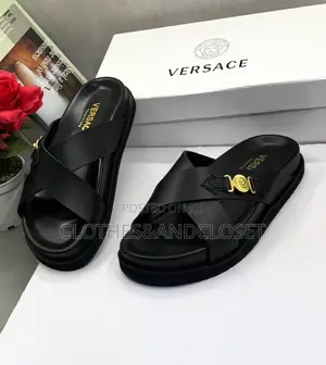 Luxury Versace Leather Sandals Featuring a Crisscross Upper.