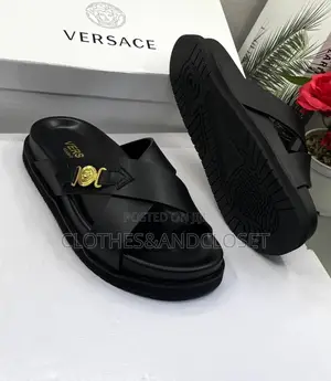 Luxury Versace Leather Sandals Featuring a Crisscross Upper.