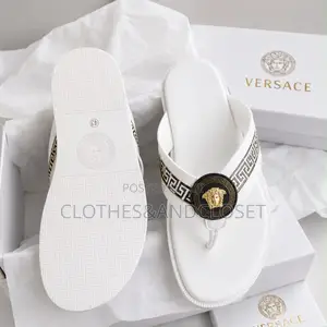 Versace Thong Sandals Feature a Distinctive Gold Medusa Head Medallion