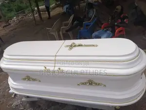 White Oval-Top Casket With Gold Trim