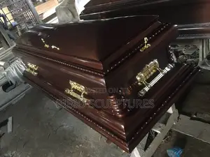 Mahogany-Finish Casket With Carved Pillars