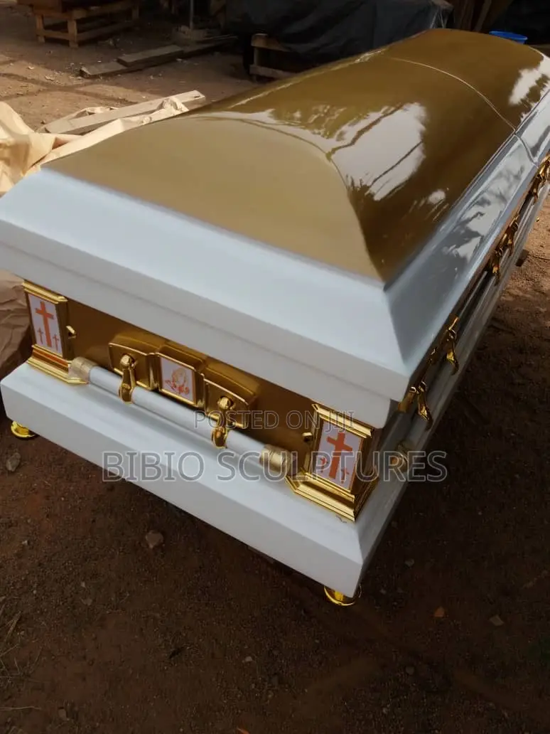 White and Gold Casket With Brown Lid