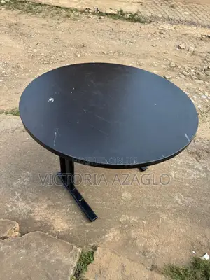 Round Cantilever Table