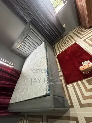 A Foreign Mattress and Bed-Stand for Sale.