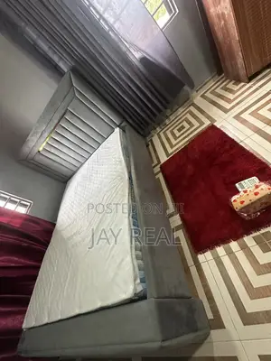 A Foreign Mattress and Bed-Stand for Sale.
