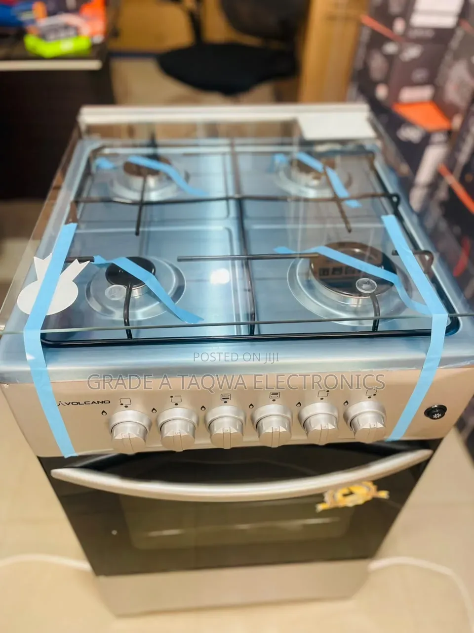 A Glass Top Lid Volcano 50-50 Four Burners Gas Cooker