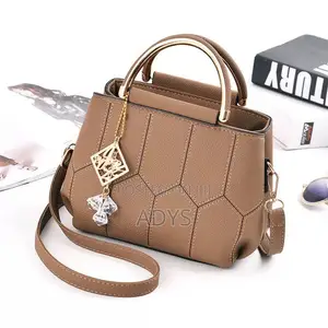 Brown Geometric Hand Bags
