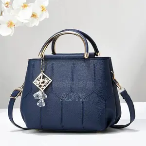 Brown Geometric Hand Bags