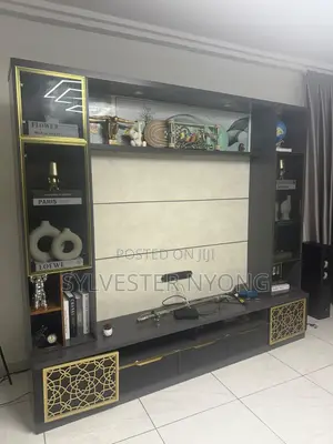 Modern Custom TV Wall Unit With Glass Cabinets and Gold Design