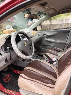 Toyota Corolla Base 4dr Sedan (1.8L 4cyl 5M) 2010 Red