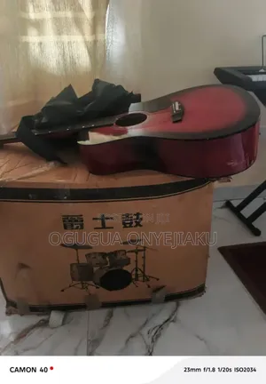 A Complete Set of Red Drum With Complimentary Guitar