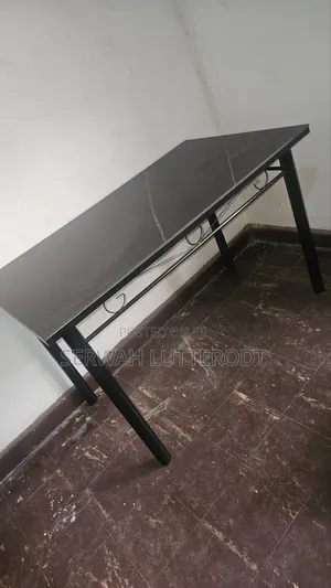 Table and 4 Chairs. (Small Chip on Side of Table)