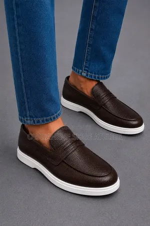 Brown Pebble-Grain Leather Penny Loafers With a Contrasting
