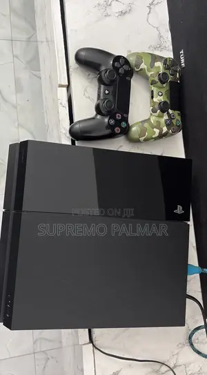 Original Sony PS4 Flat Gaming Console - Dual Controller Bundle +4games