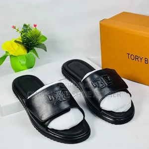 A Pair of Tory Burch Double T Sport Slides in Black