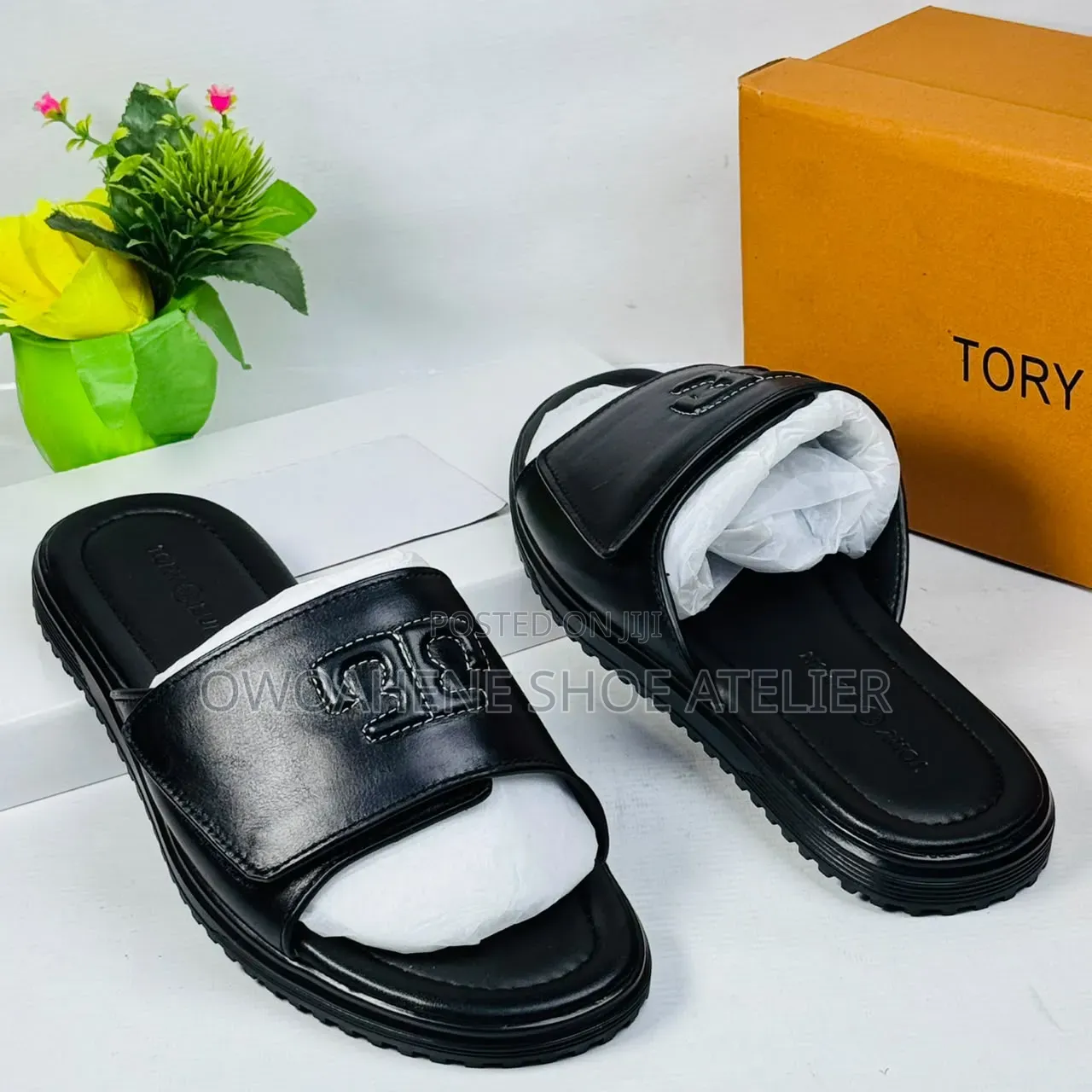 A Pair of Tory Burch Double T Sport Slides in Black