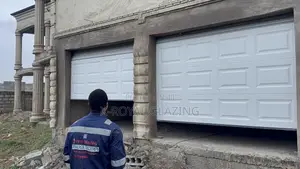 White Modern Remote Double Garage Door Well Installed