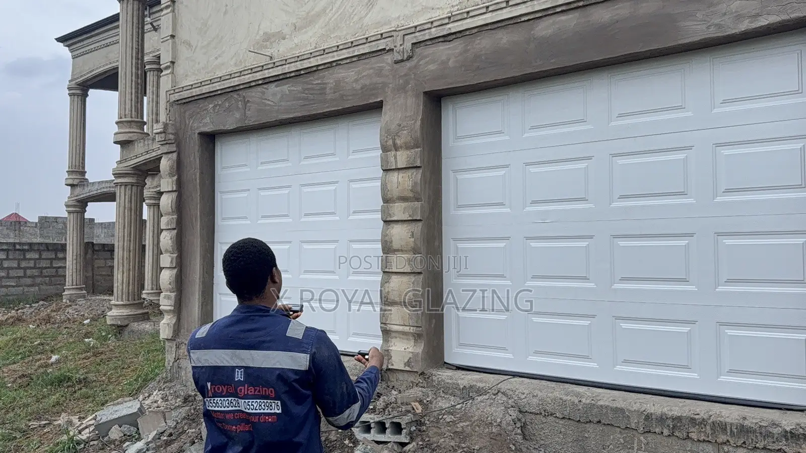 White Modern Remote Double Garage Door Well Installed