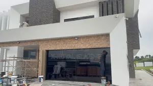 Modern Remote Control Frameless Glass Garage Door Well Installed