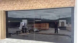 Modern Remote Control Frameless Glass Garage Door Well Installed