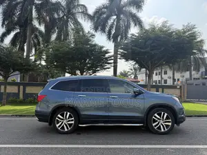 Honda Pilot Touring 4dr SUV 4WD (3.5L 6cyl 9A) 2017