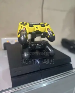 PS4 Standard With 2 Controllers and 5solid Games.