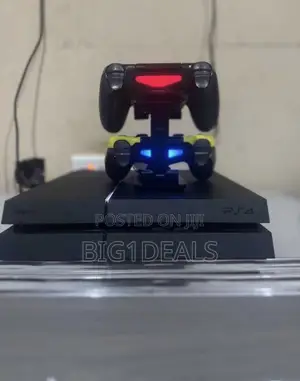 PS4 Standard With 2 Controllers and 5solid Games.