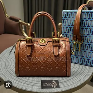 Embossed Monogram Pattern and Buckled Top Handle
