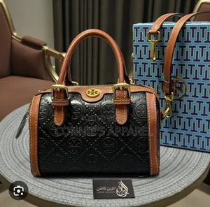 Embossed Monogram Pattern and Buckled Top Handle
