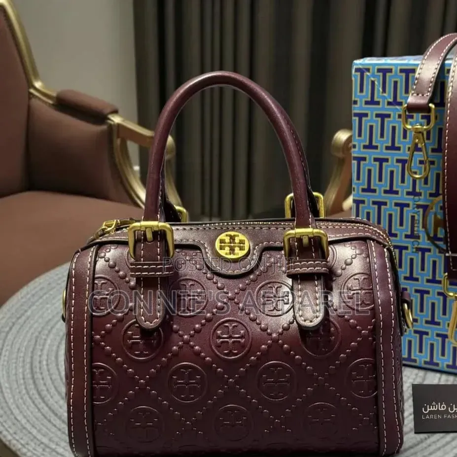 Embossed Monogram Pattern and Buckled Top Handle