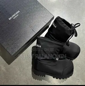 A Pair of Black Balenciaga Alaska Low Boots Featuring Exaggerated