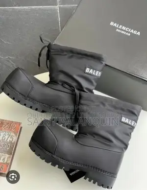 A Pair of Black Balenciaga Alaska Low Boots Featuring Exaggerated