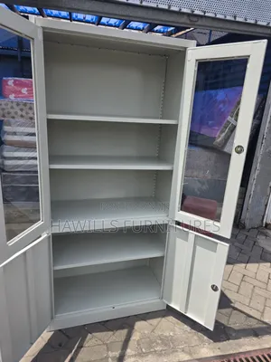Metal Cabinet With Glass Top Doors and Solid Bottom Doors.