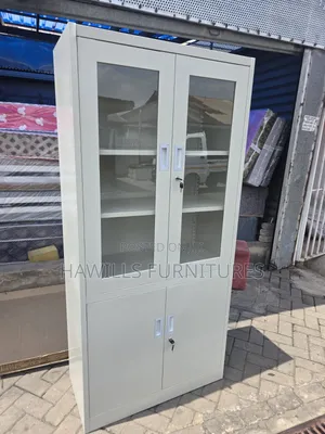 Metal Cabinet With Glass Top Doors and Solid Bottom Doors.