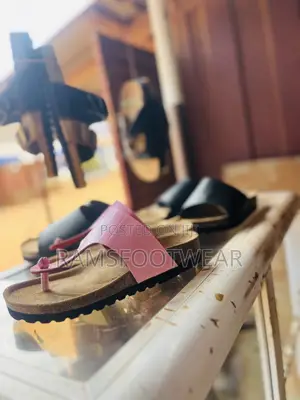 Pink Croc-Embossed Thong Sandal Featuring a Classic Cork Footbed.