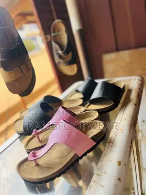 Pink Croc-Embossed Thong Sandal Featuring a Classic Cork Footbed.
