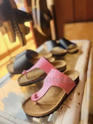Pink Croc-Embossed Thong Sandal Featuring a Classic Cork Footbed.