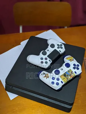 Ps4 Console With 2 Controllers and 4 Games