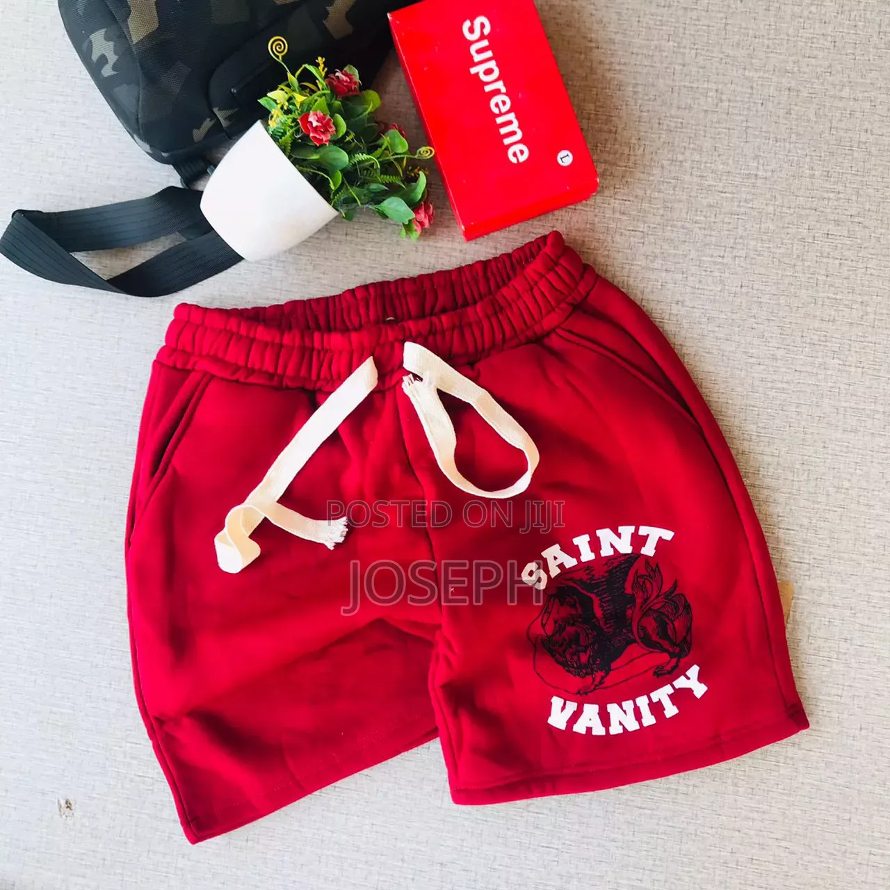 Red Graphic Drawstring Shorts With a Bold Dripping-Style Design