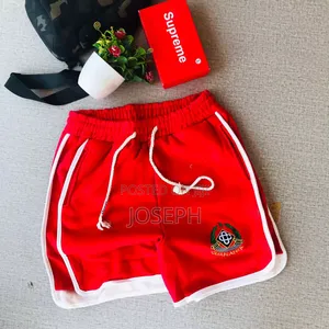 Red Graphic Drawstring Shorts With a Bold Dripping-Style Design