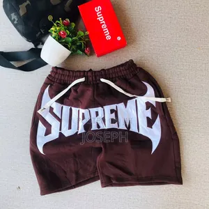 Red Graphic Drawstring Shorts With a Bold Dripping-Style Design