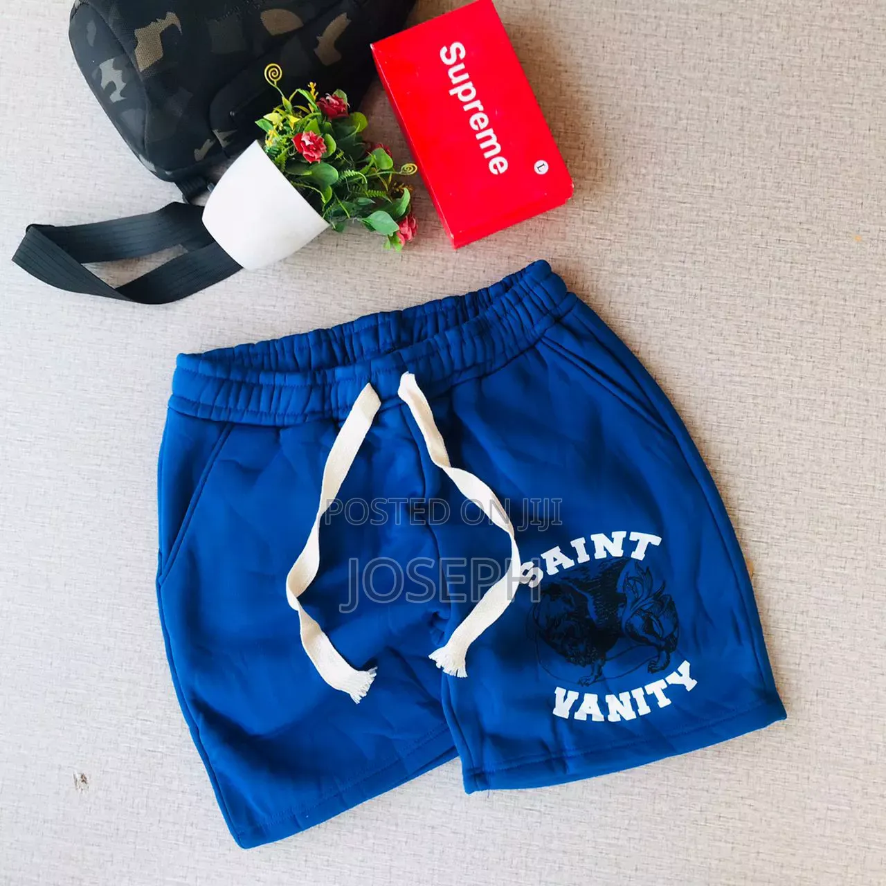 Red Graphic Drawstring Shorts With a Bold Dripping-Style Design