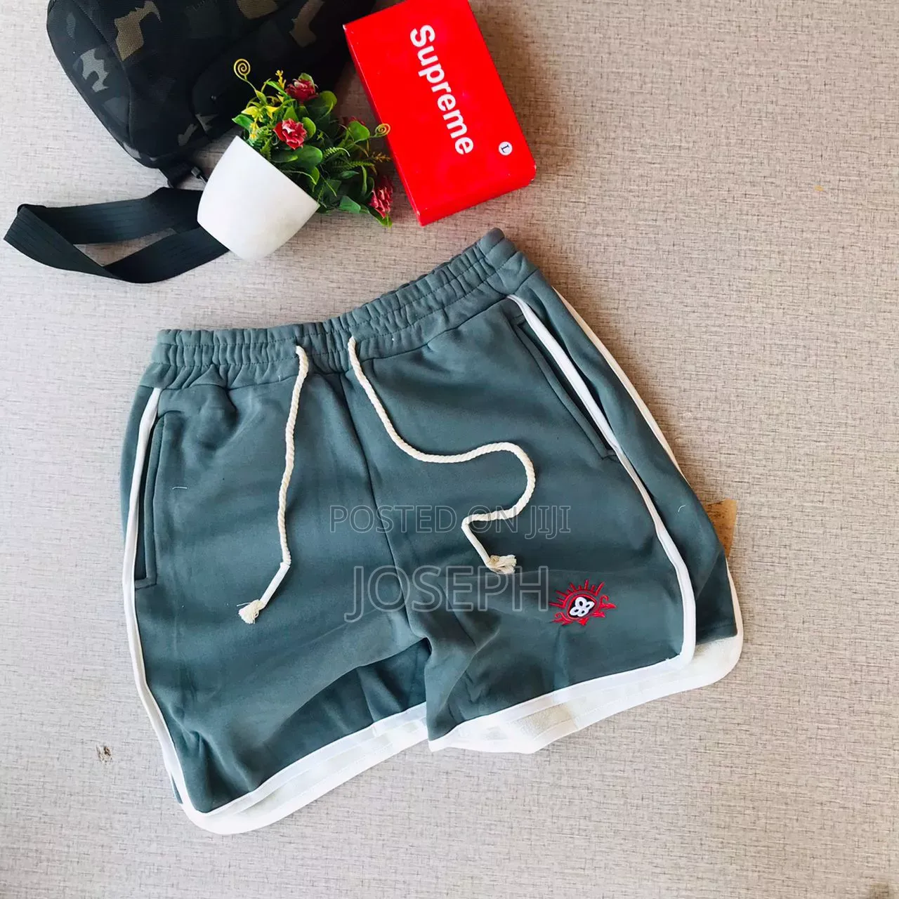 Red Graphic Drawstring Shorts With a Bold Dripping-Style Design